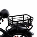 The black wire mesh cargo basket of the Blackrock X1 rear rack, mounted over the rear fender behind the saddle
