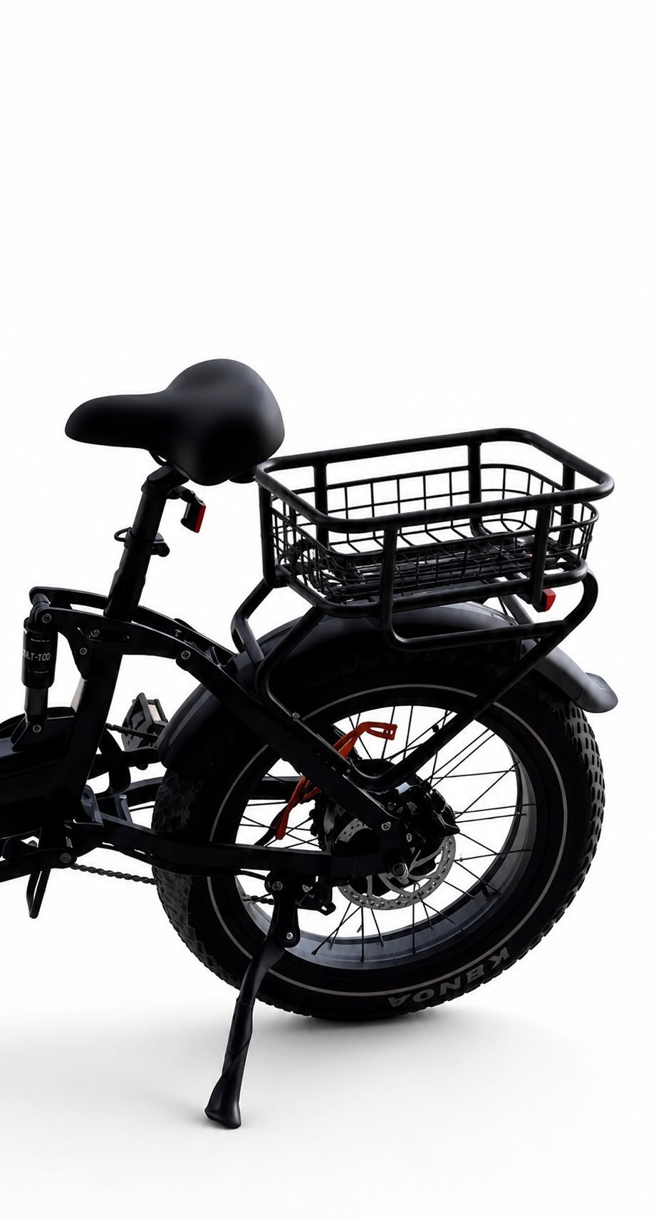 The rear cargo rack and wire mesh basket fitted to the back of the Blackrock X1 electric bike, above the rear fender and fat tire
